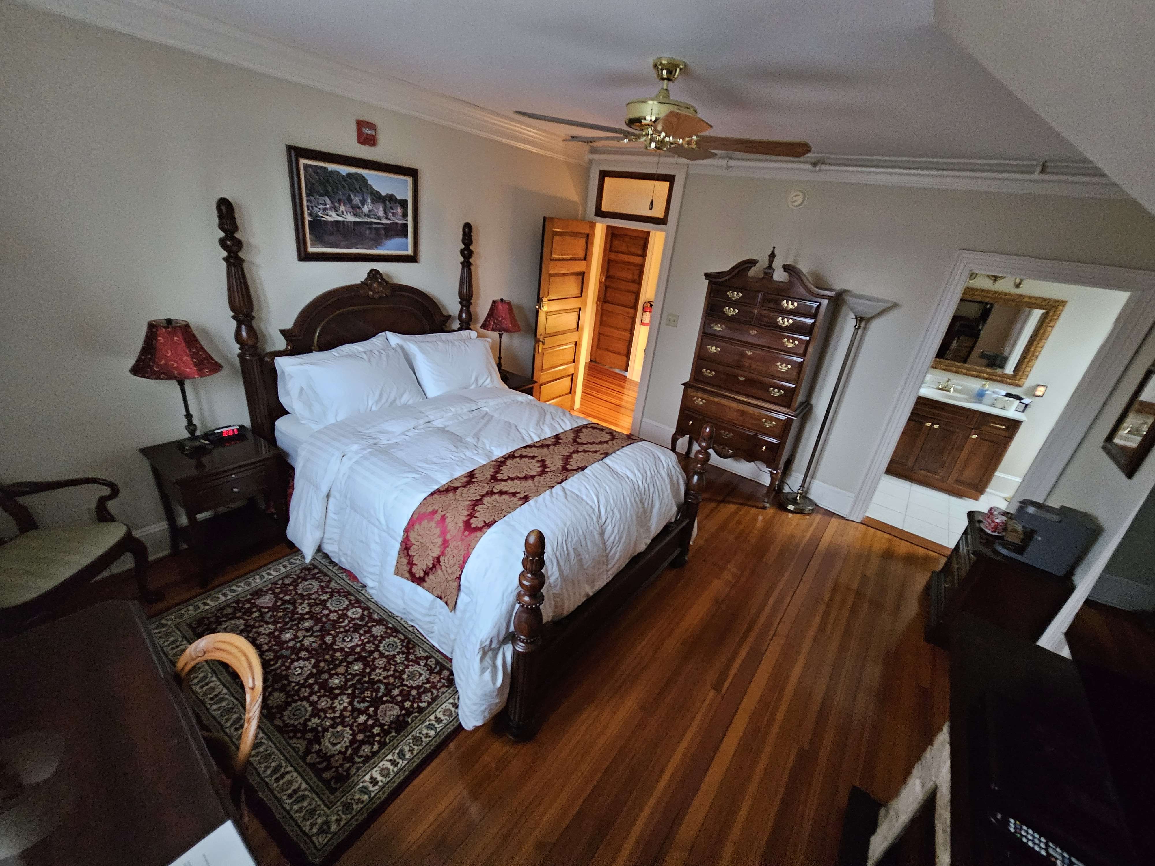 Red room bed and view into hallway